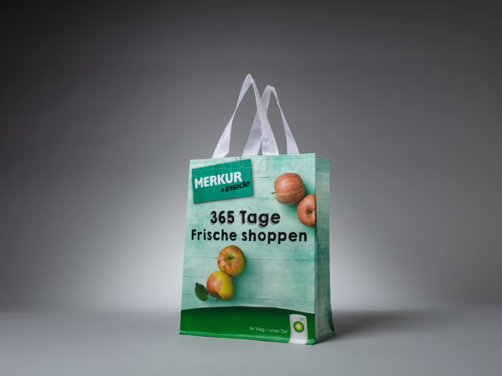 Borsa da trasporto verde laminata in tessuto non tessuto per Merkur – stampata da Paolo Sandro